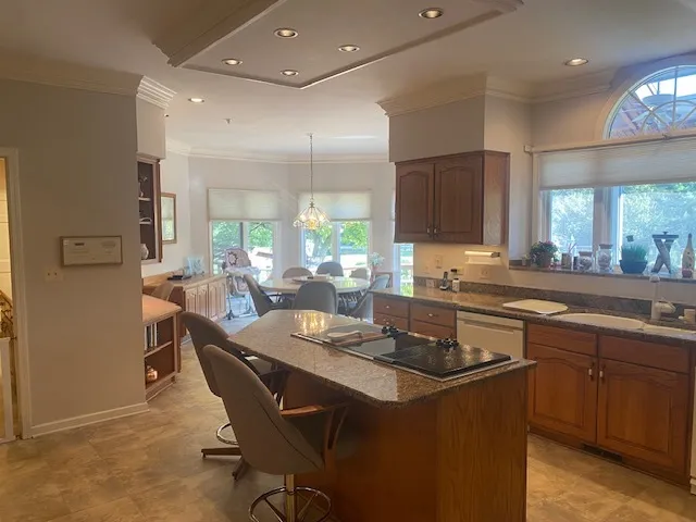 a kitchen with a sink stove and cabinets