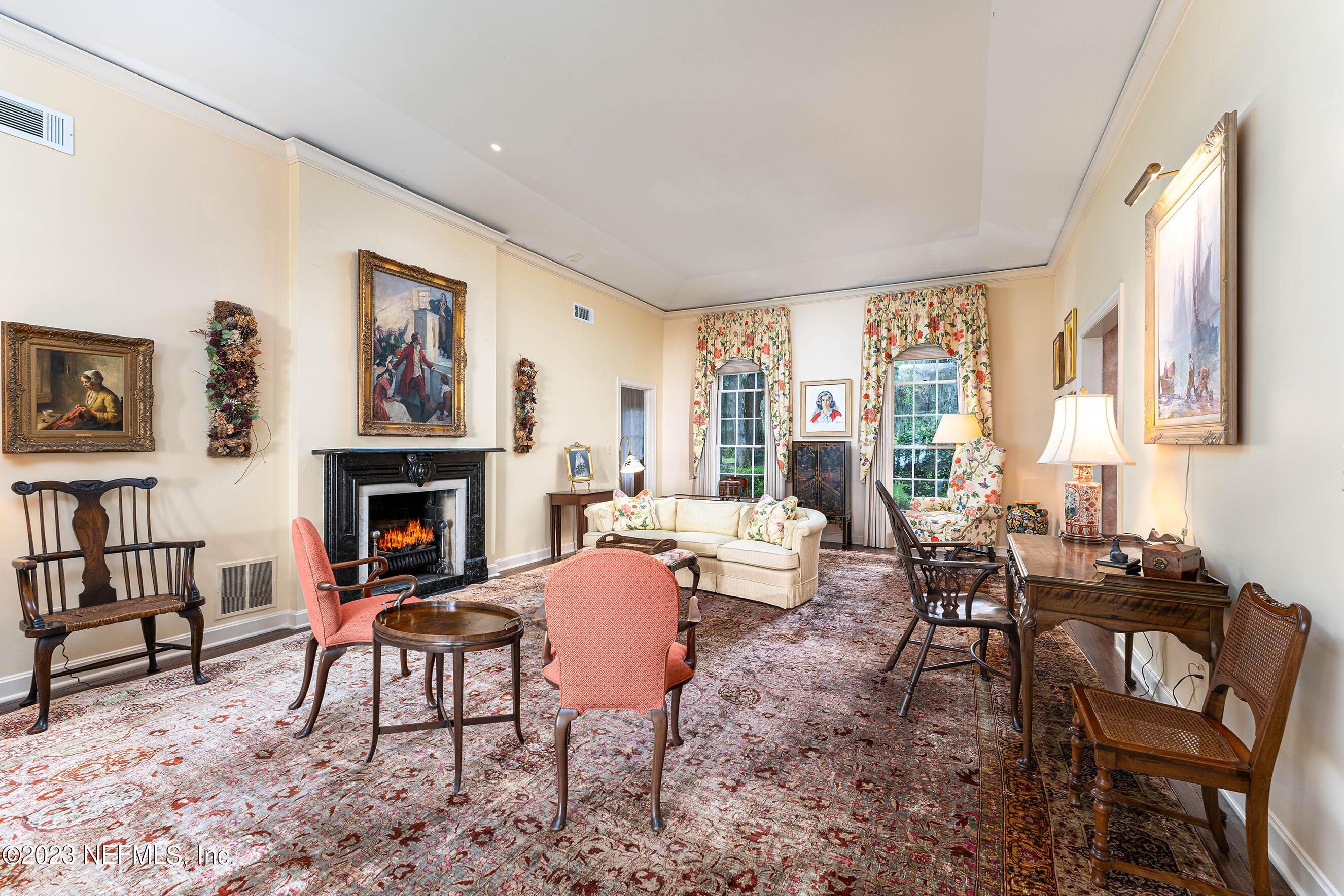 6975 Old Church Road Fleming Island, FL 32003 - Photo 13 of 53 a living room with furniture a fireplace and a large window