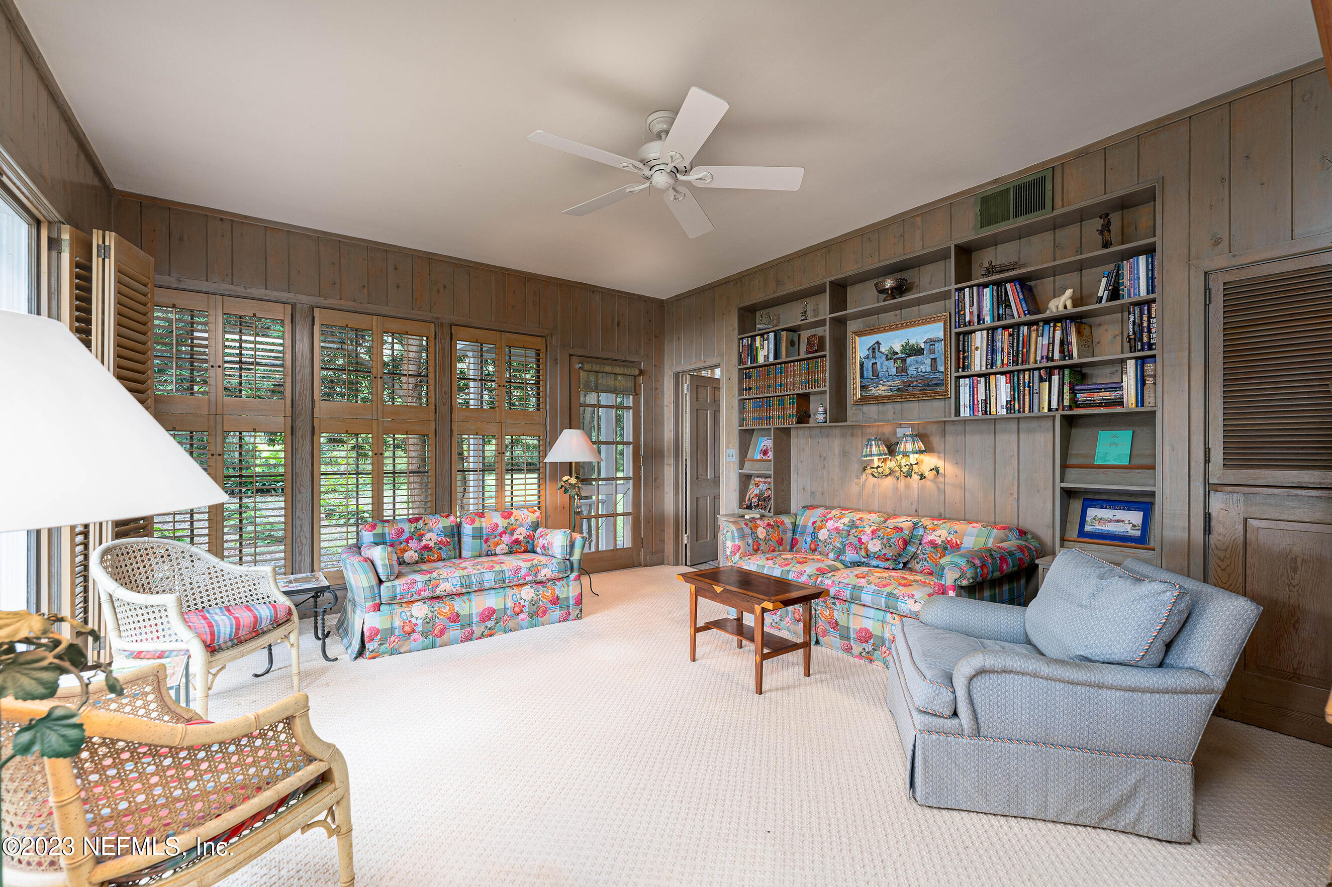 6975 Old Church Road Fleming Island, FL 32003 - Photo 14 of 53 a living room with furniture and a book shelf