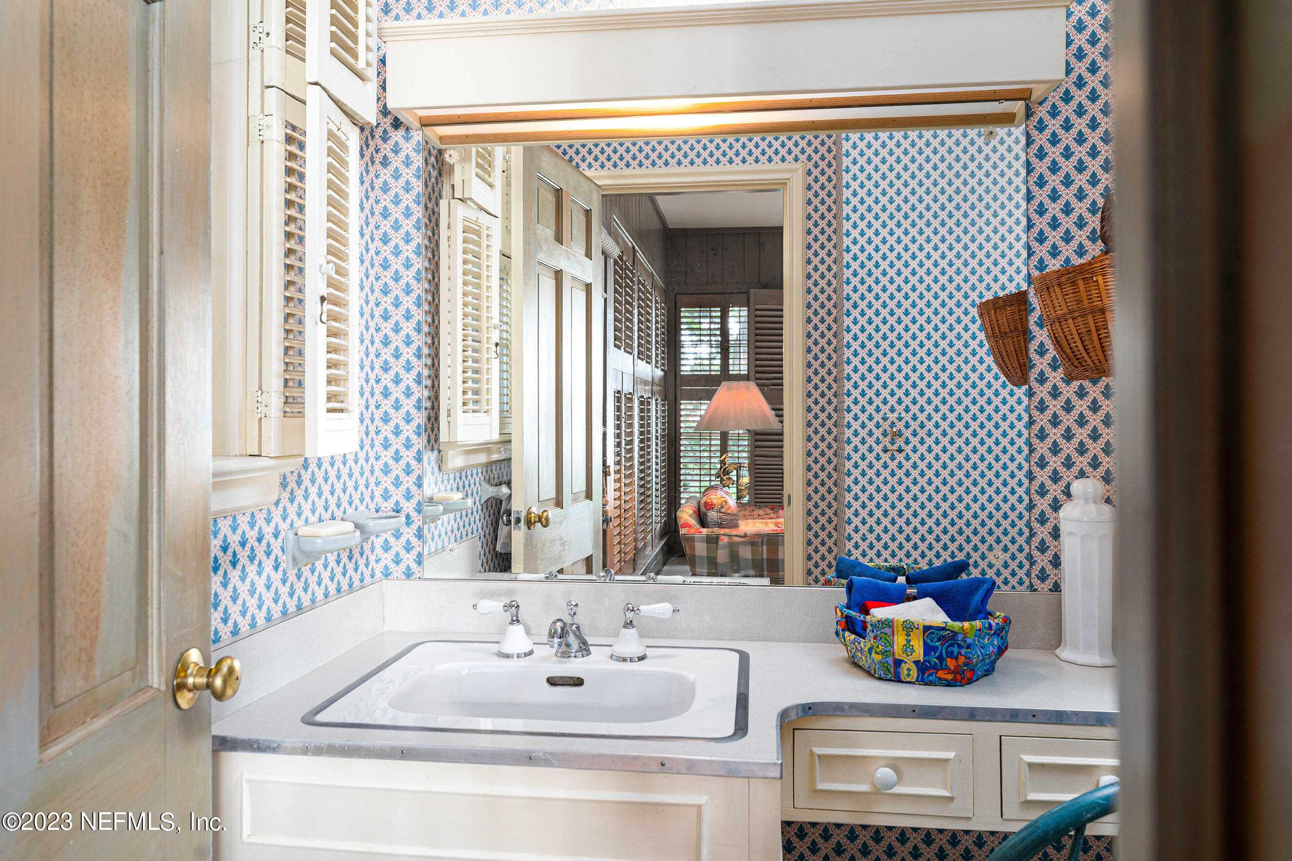 6975 Old Church Road Fleming Island, FL 32003 - Photo 17 of 53 a bathroom with a sink and a mirror