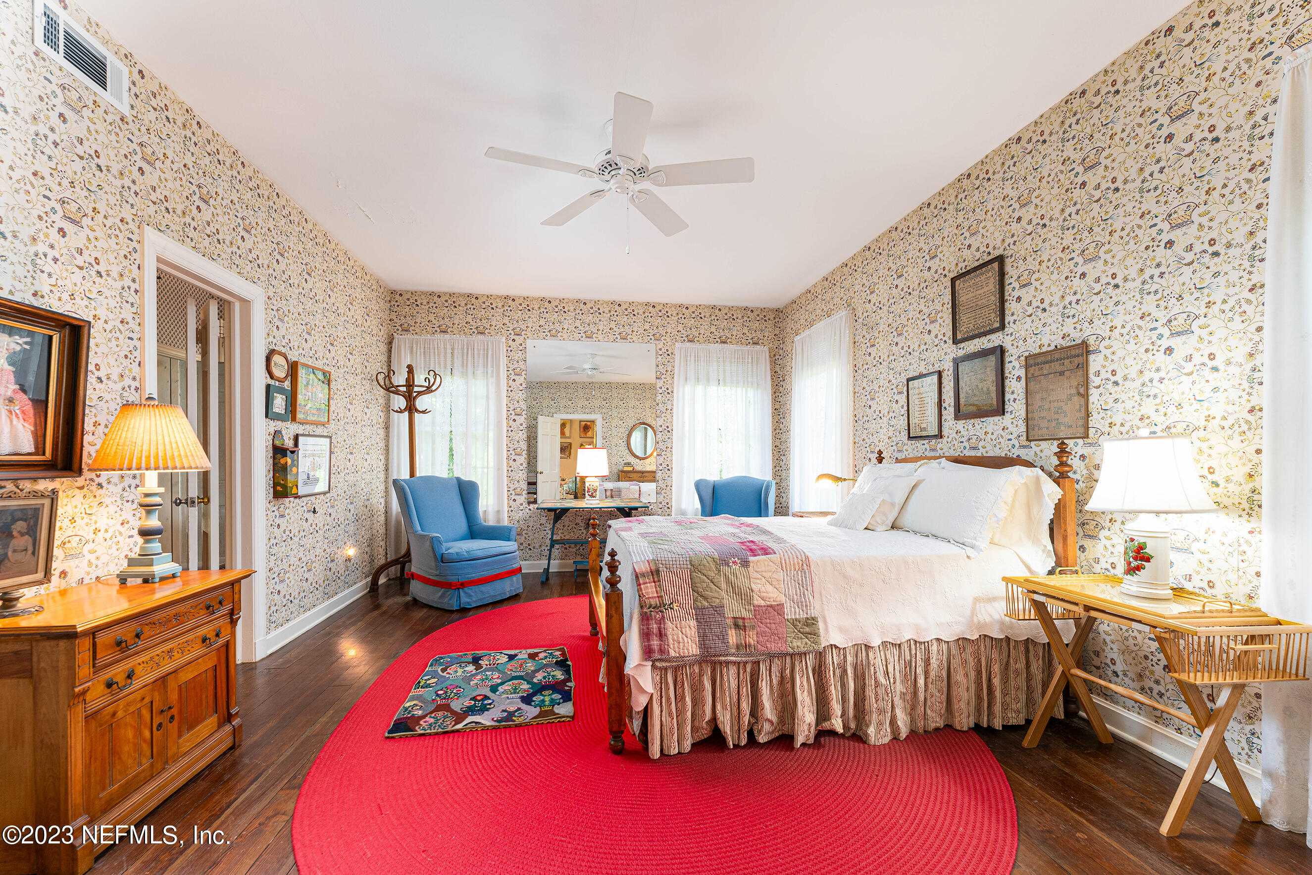6975 Old Church Road Fleming Island, FL 32003 - Photo 20 of 53 a bedroom with a bed and wooden floor