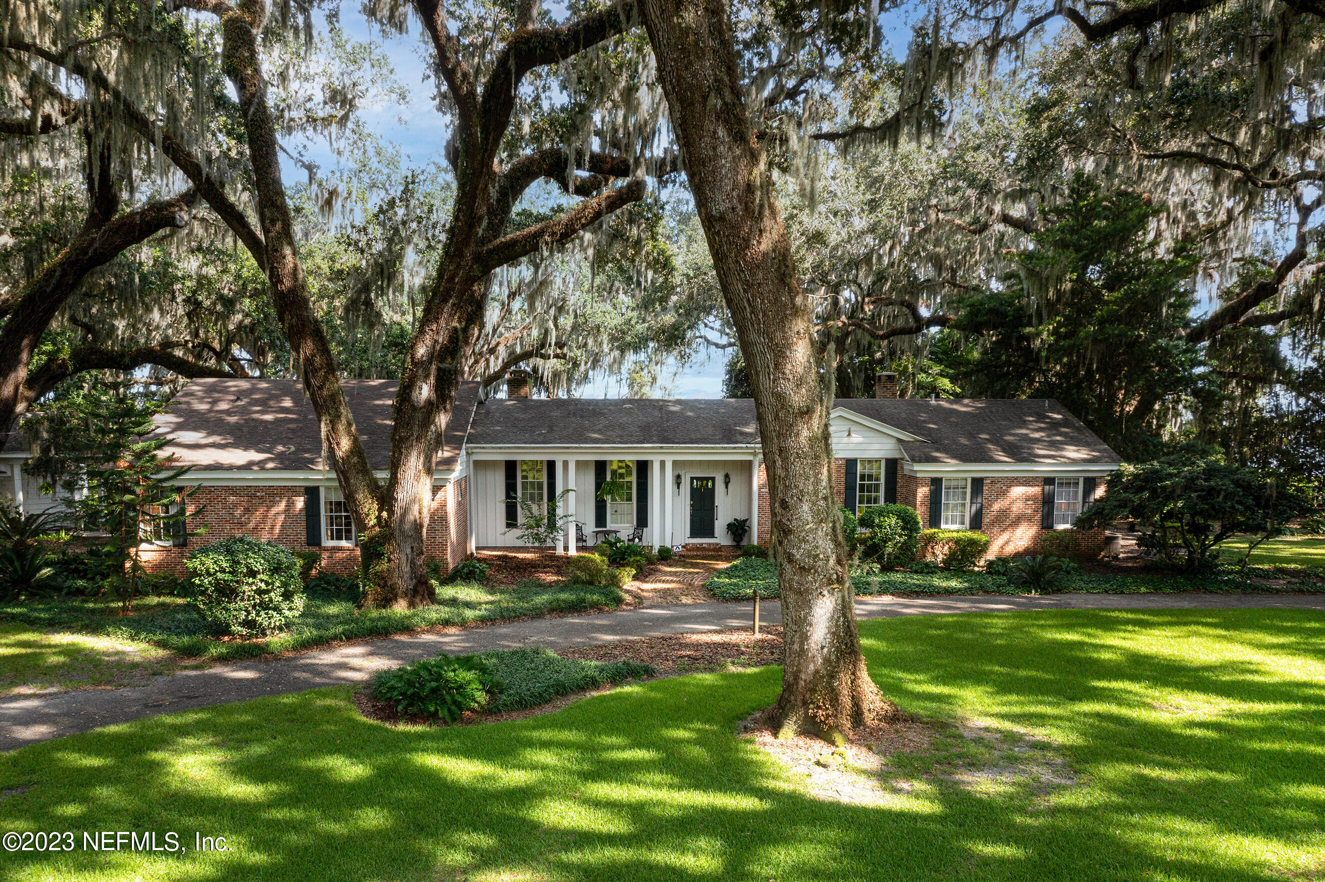 6975 Old Church Road Fleming Island, FL 32003 - Photo 2 of 53 a front view of a house with a yard tree and tree