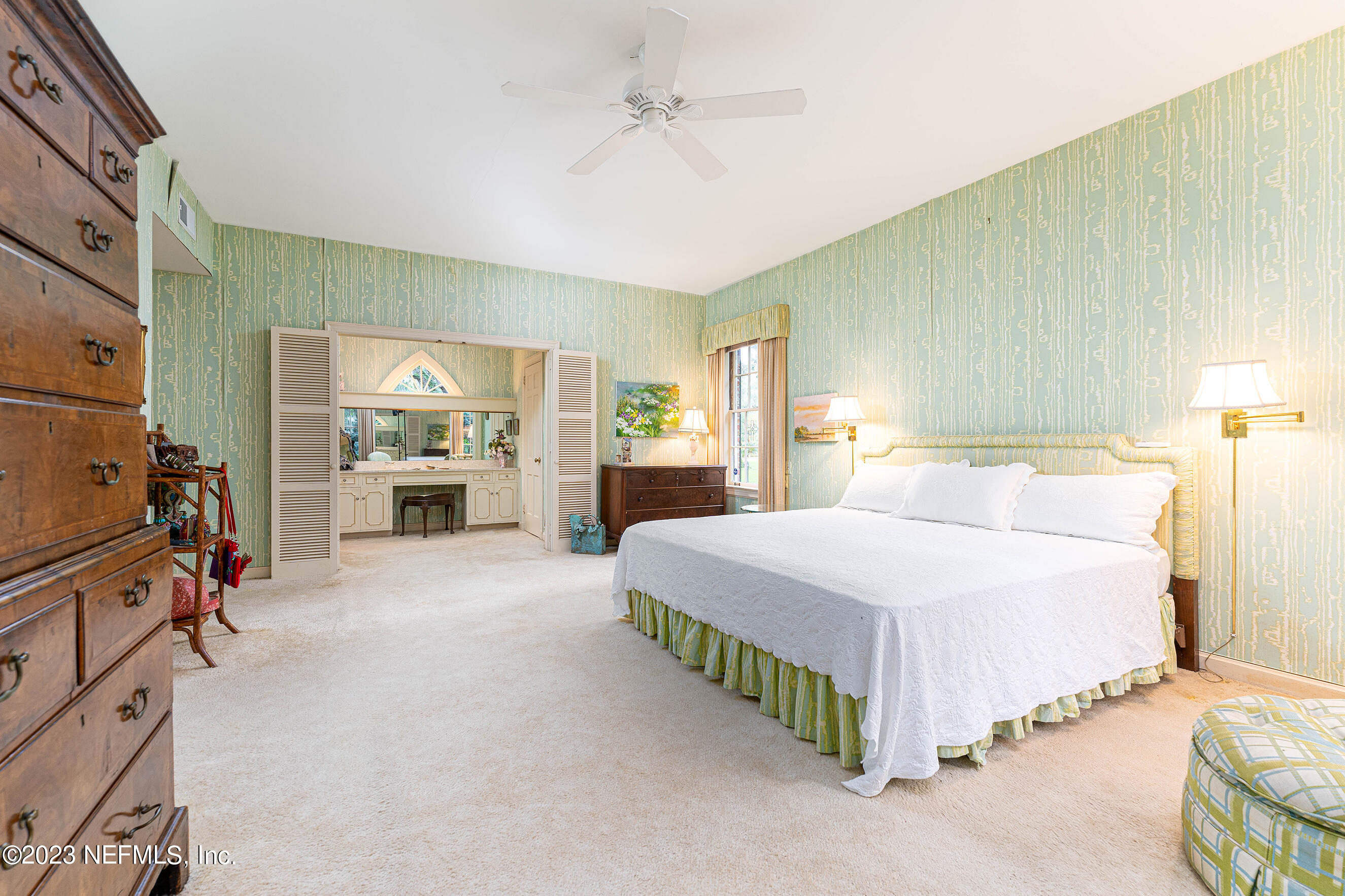 6975 Old Church Road Fleming Island, FL 32003 - Photo 26 of 53 a spacious bedroom with a bed and a dresser