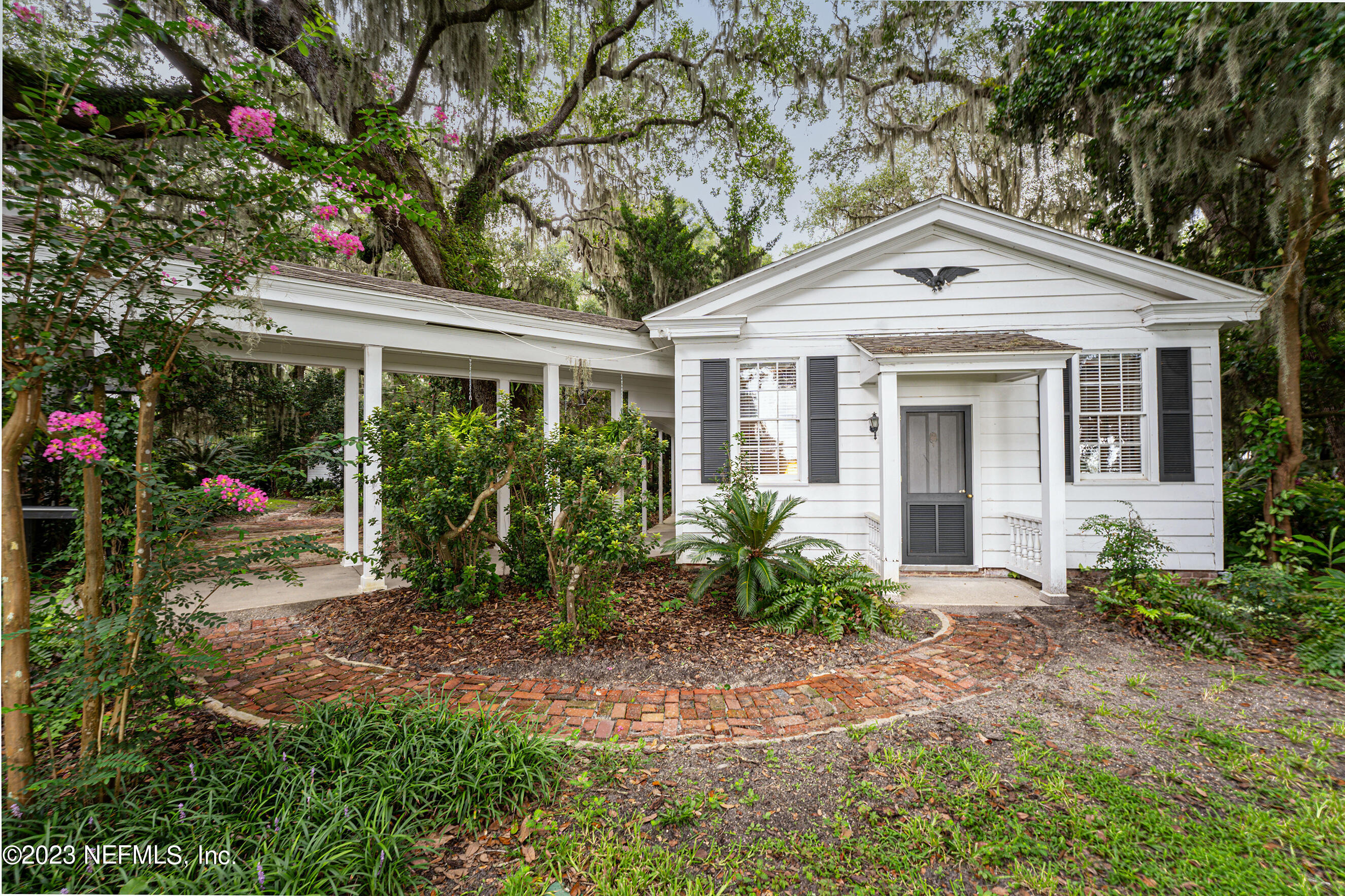 6975 Old Church Road Fleming Island, FL 32003 - Photo 38 of 53 a front view of a house with garden