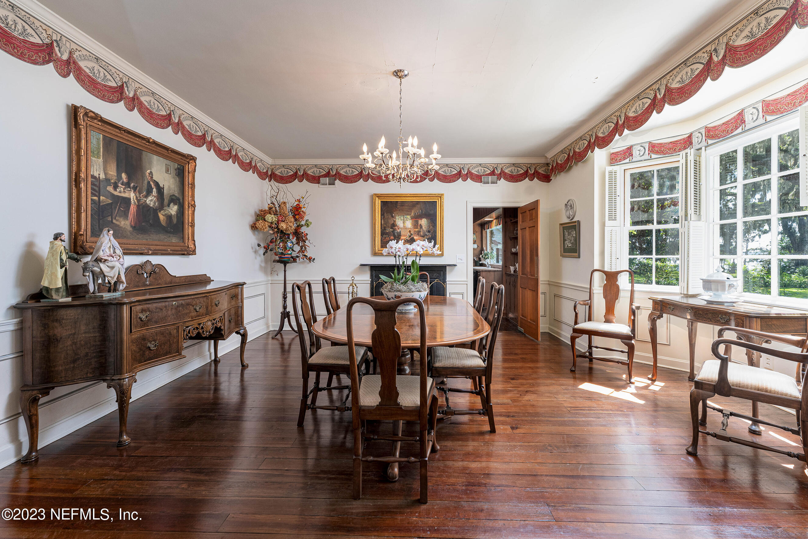 6975 Old Church Road Fleming Island, FL 32003 - Photo 4 of 53 a view of a dining room with furniture window and wooden floor