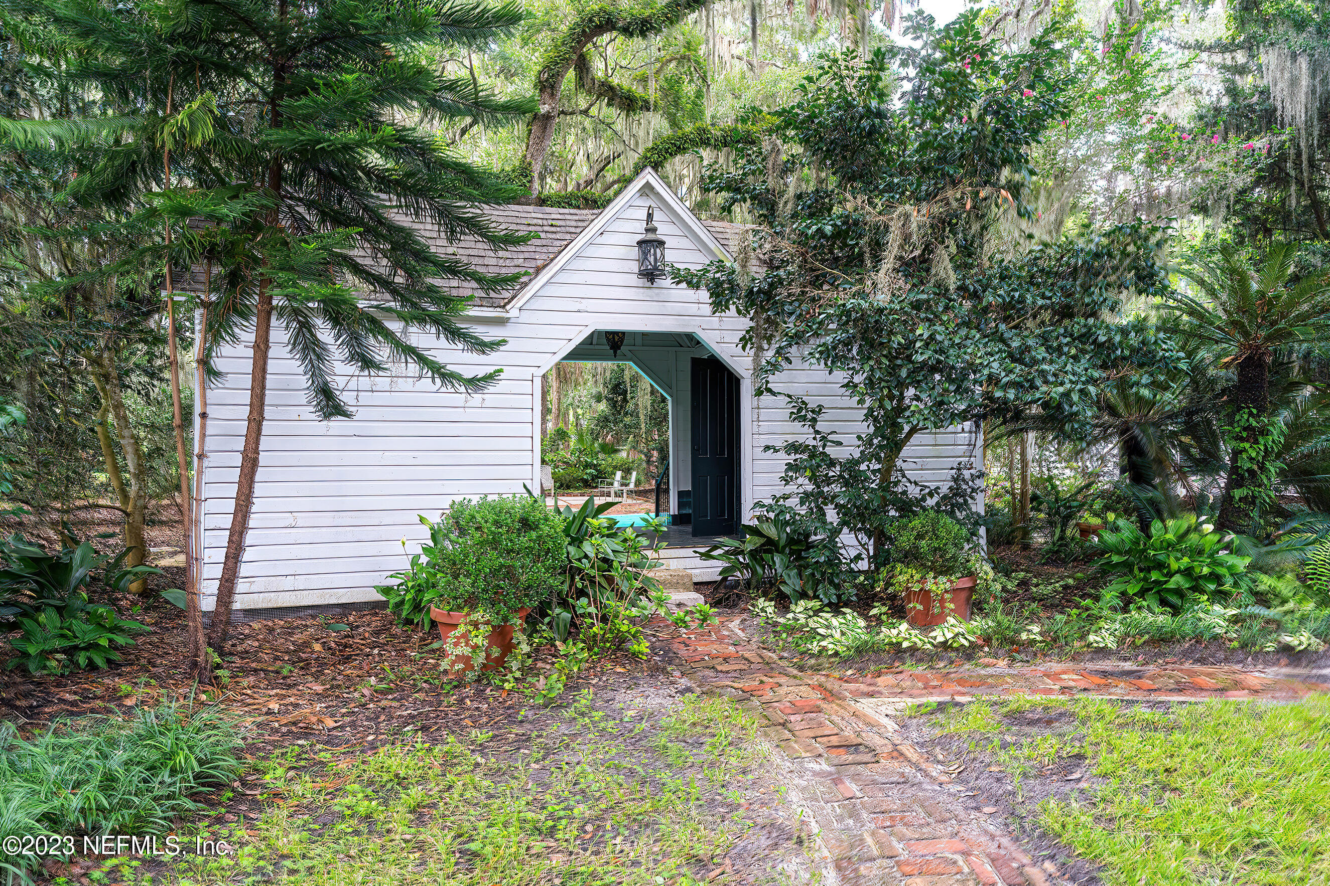 6975 Old Church Road Fleming Island, FL 32003 - Photo 46 of 53 a front view of a house with garden