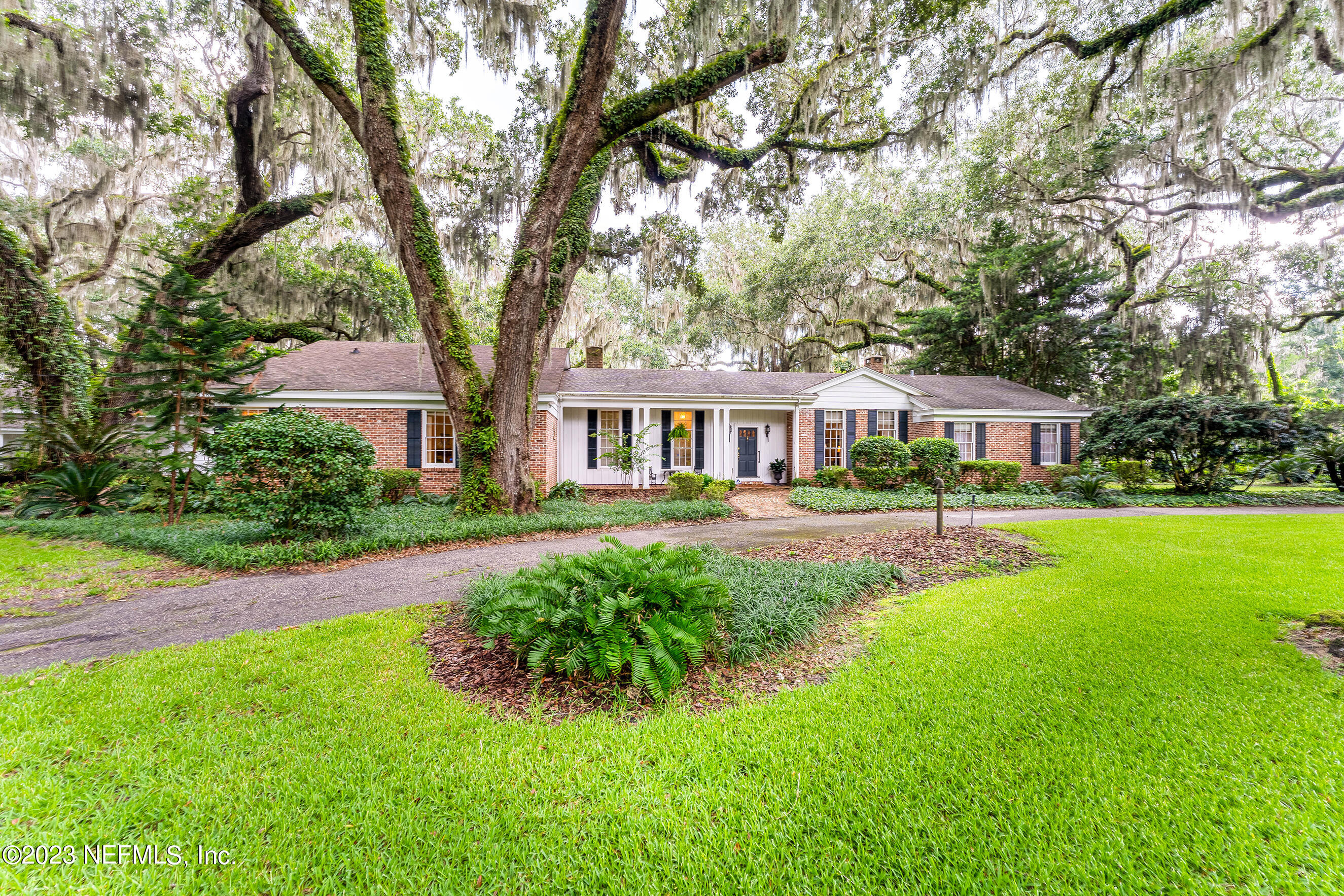 6975 Old Church Road Fleming Island, FL 32003 - Photo 47 of 53 a front view of a house with a yard and trees