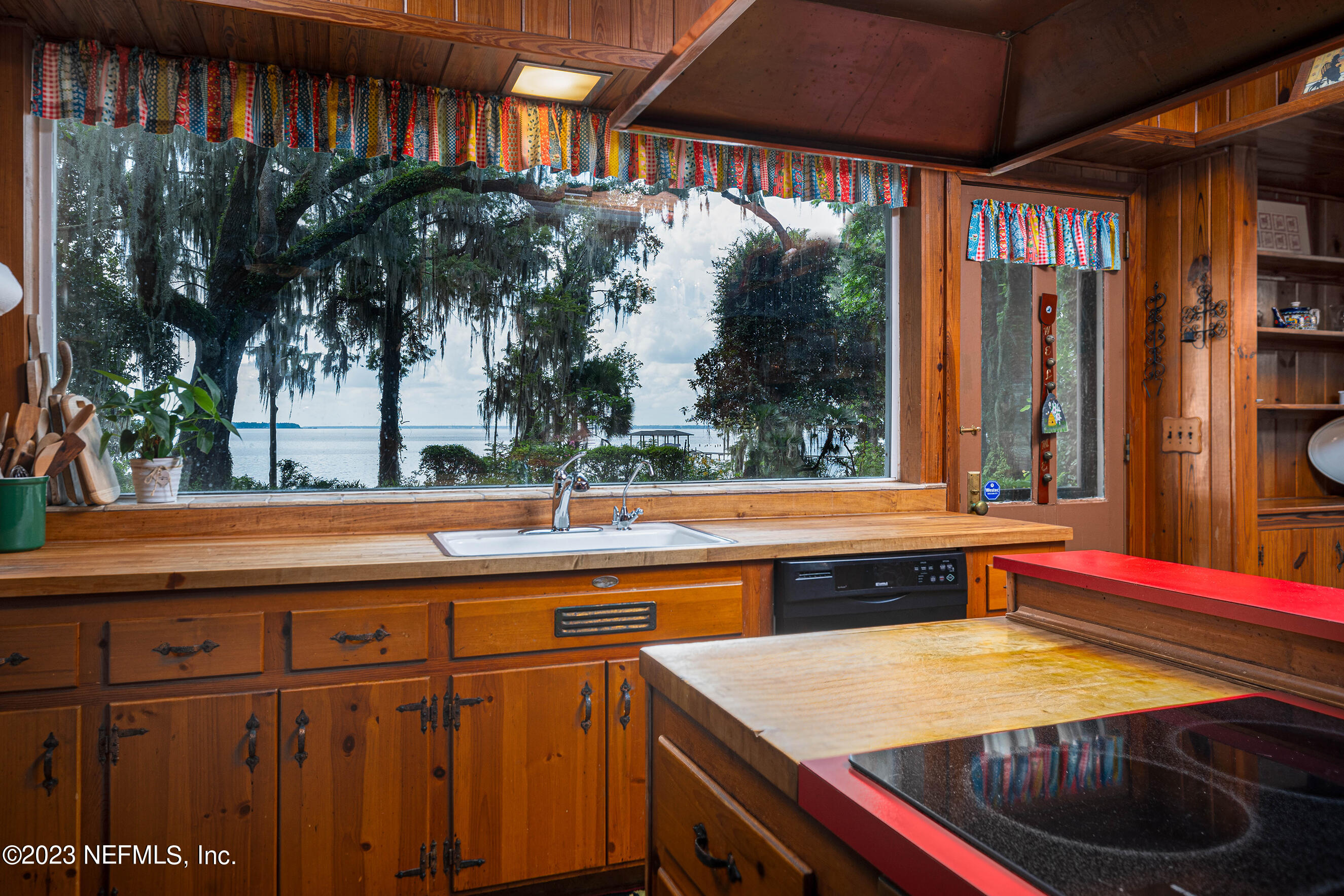 6975 Old Church Road Fleming Island, FL 32003 - Photo 7 of 53 a dinning table and chairs in front of a house