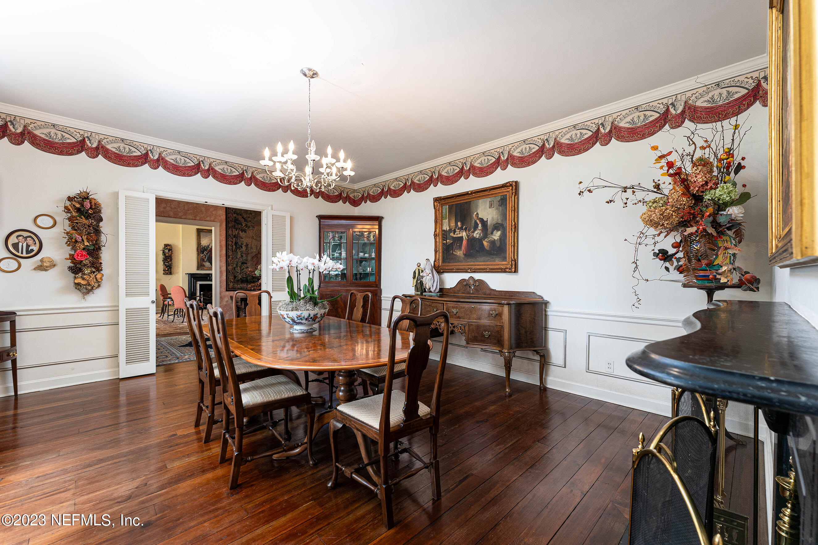 6975 Old Church Road Fleming Island, FL 32003 - Photo 9 of 53 a view of a dining room with furniture and wooden floor