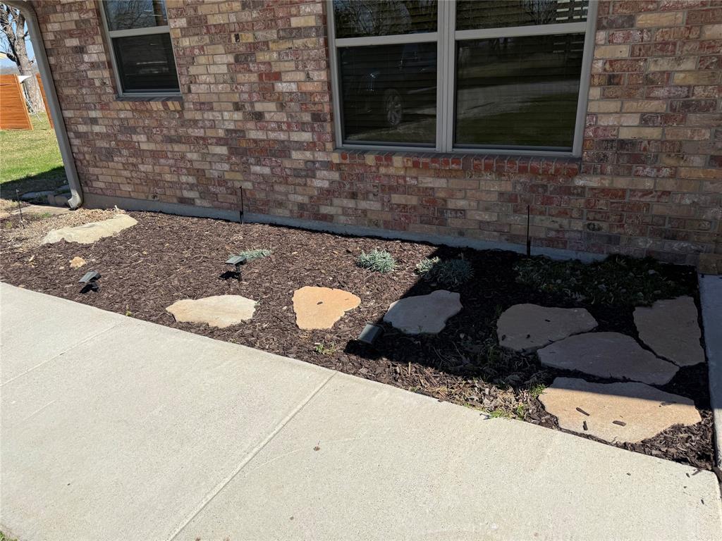902 North 4th Street Wills Point, TX 75169 - Photo 2 of 15 a stove top oven sitting inside of a kitchen