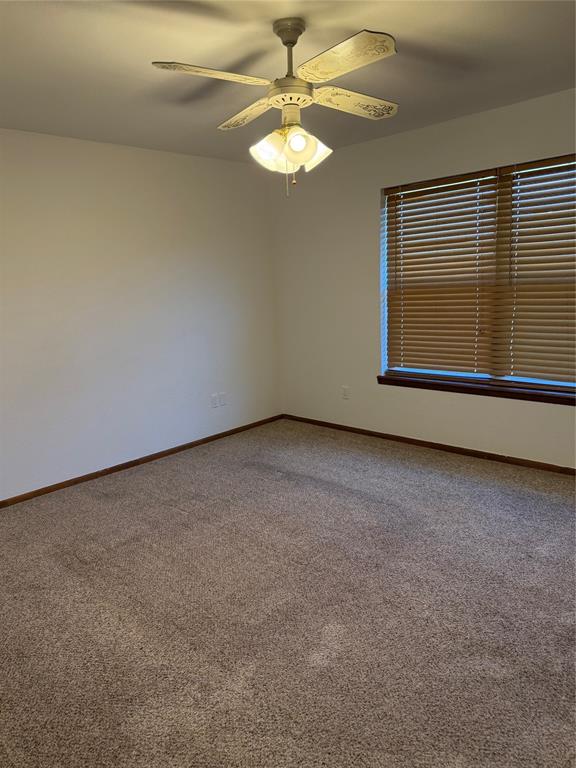 902 North 4th Street Wills Point, TX 75169 - Photo 7 of 15 a view of an empty room with a window