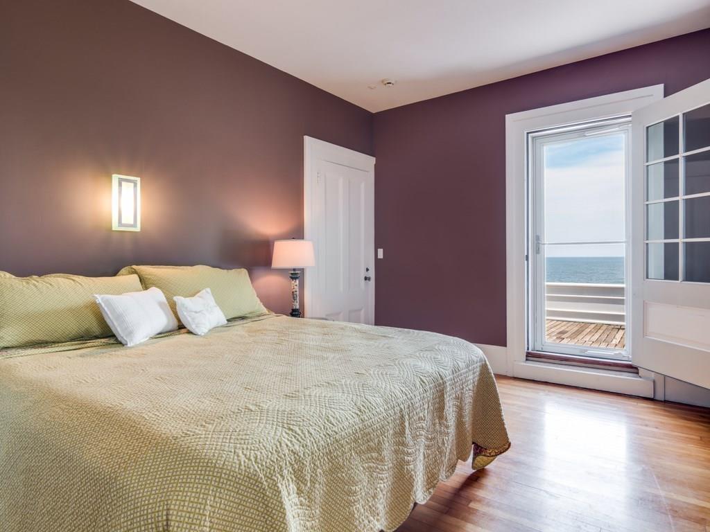 391 Nahant Road Nahant, MA 01908 - Photo 24 of 42 a bedroom with a bed and a window