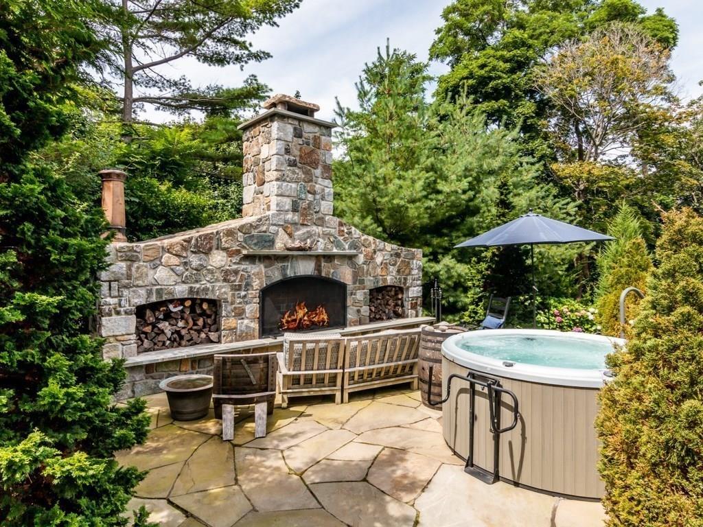 391 Nahant Road Nahant, MA 01908 - Photo 29 of 42 a view of a chairs and table in the back yard of the house