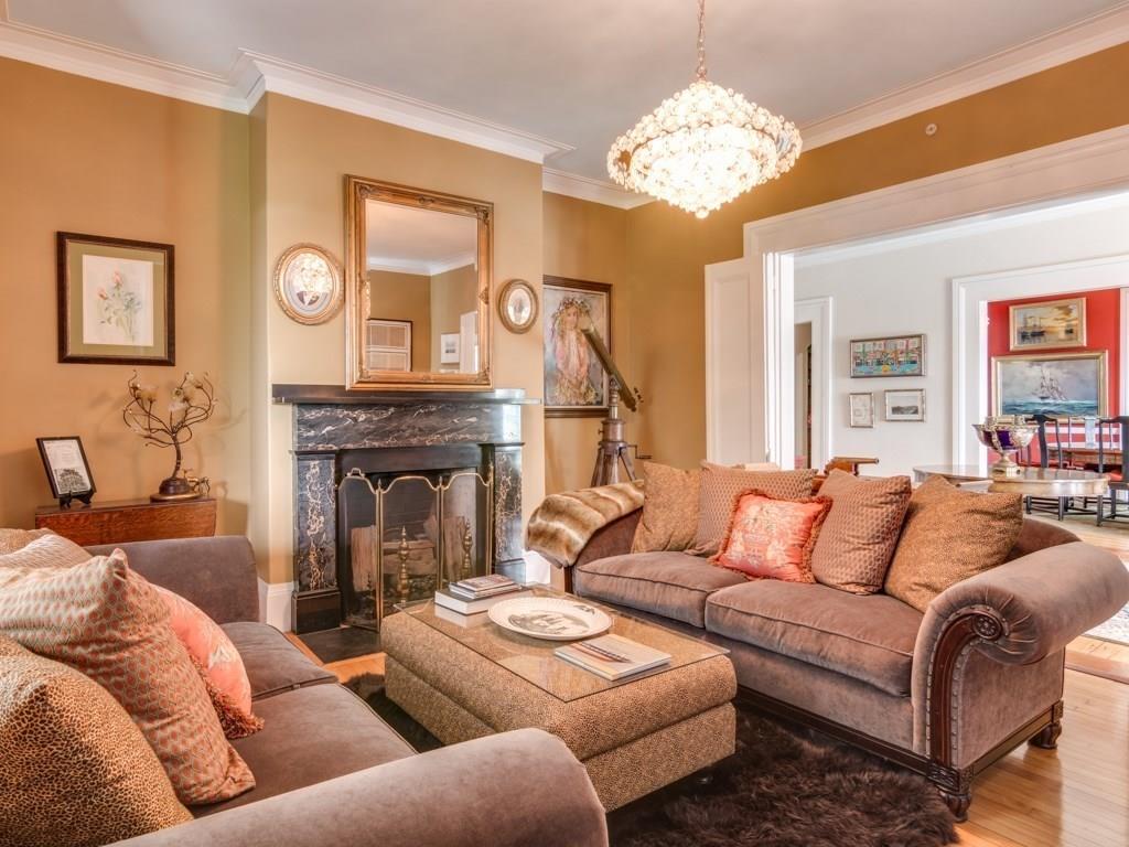 391 Nahant Road Nahant, MA 01908 - Photo 6 of 42 a living room with furniture a fireplace and a chandelier