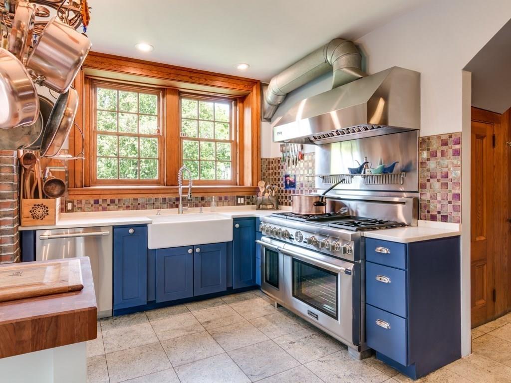 391 Nahant Road Nahant, MA 01908 - Photo 8 of 42 a kitchen with a stove top oven sink and cabinets