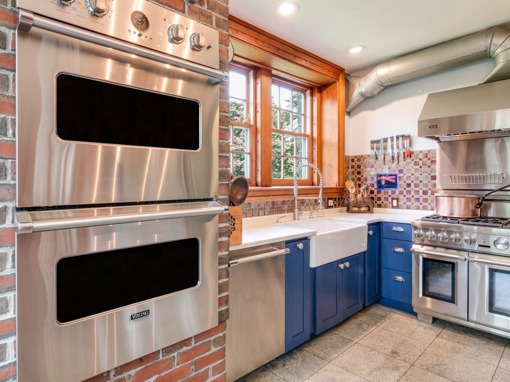 391 Nahant Road Nahant, MA 01908 - Photo 9 of 42 a kitchen with stainless steel appliances granite countertop a stove microwave and sink