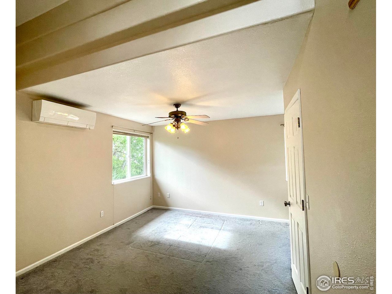 1345 Georgetown Road Boulder, CO 80305 - Photo 15 of 38 Newly painted primary bedroom with Devil's Thumb views