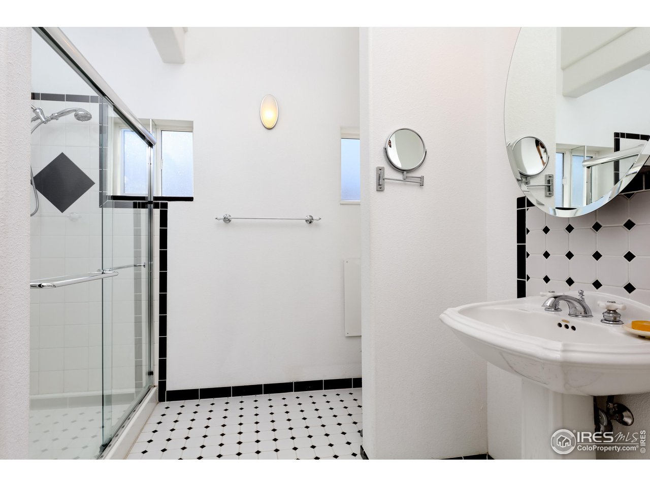 1345 Georgetown Road Boulder, CO 80305 - Photo 30 of 38 Primary bathroom with art deco tiling; there is room for an additional vanity
