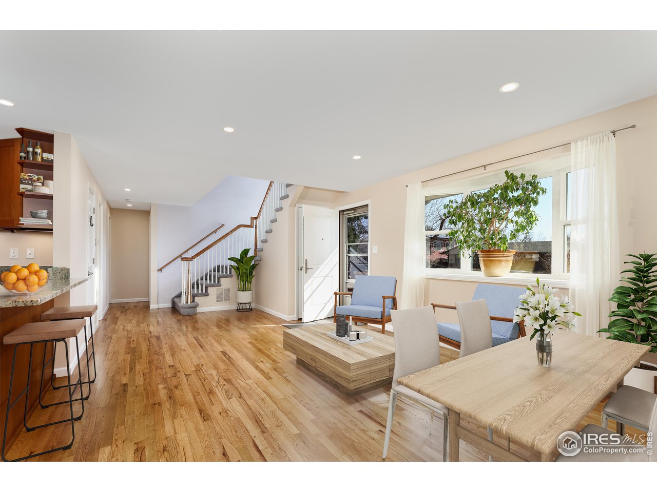 1345 Georgetown Road Boulder, CO 80305 - Photo 4 of 38 Sunny, open flow main floor with beautiful hardwoods. 3 beds on main. One makes a great office/tv/rec room.