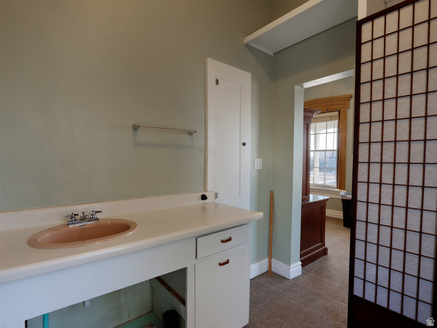 155 West Center Street Fillmore, UT 84631 - Photo 50 of 86 Vanity area featuring a built-in countertop with an oval sink, chrome faucet, and cabinet storage