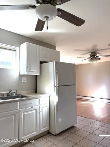 a view of an empty room and a window