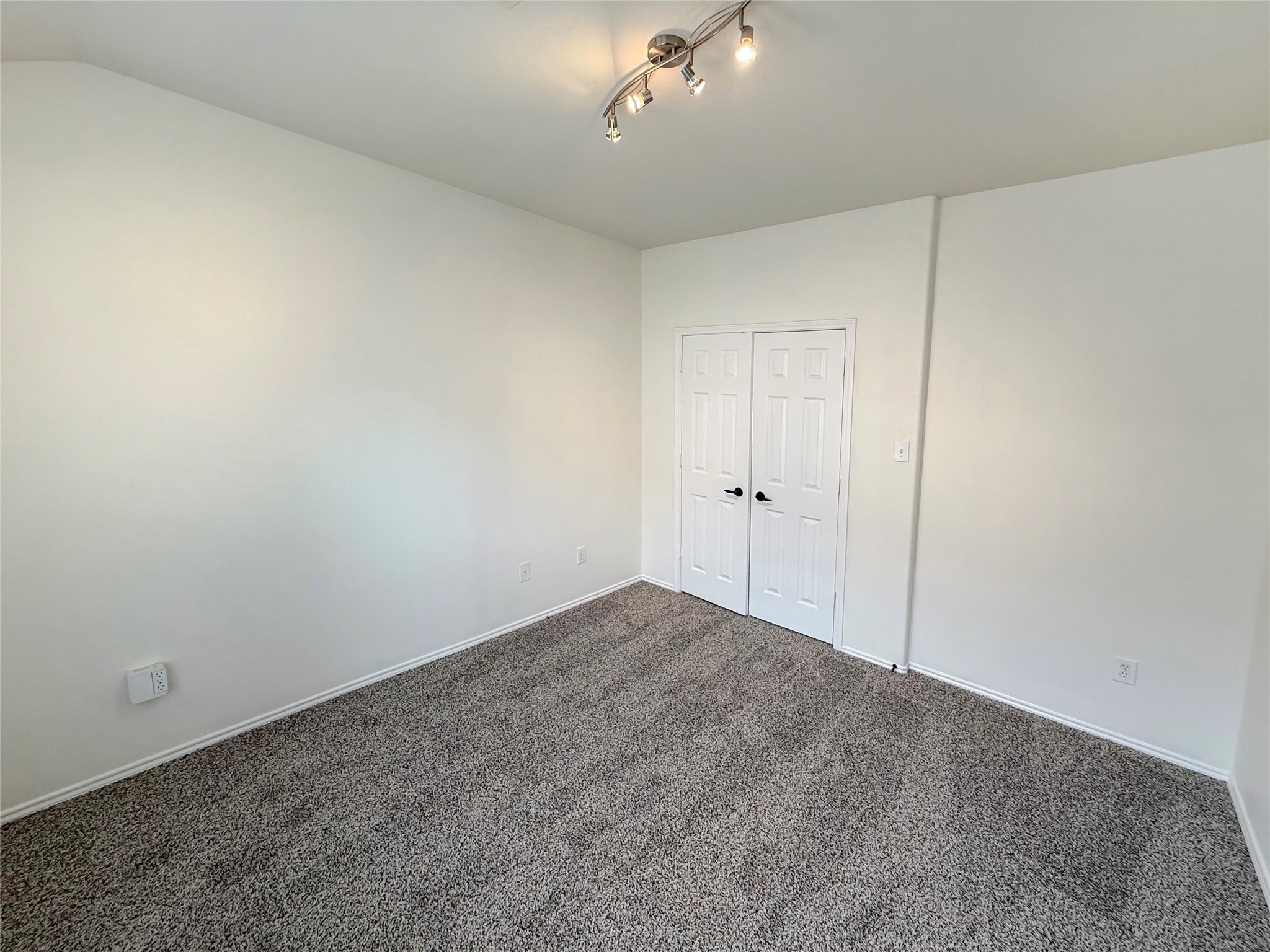 19531 Village Of Bridgestone Lane Spring, TX 77379 - Photo 18 of 40 a view of an empty room and a chandelier fan