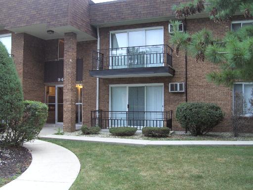 front view of a house with a garden