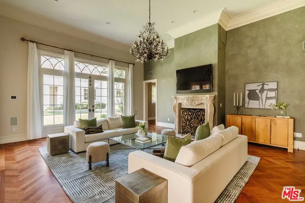 a living room with fireplace furniture and a flat screen tv