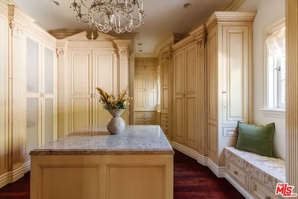 a view of living room with furniture and wooden floor
