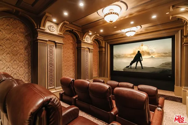 a media room with lots of chairs and a projector screen