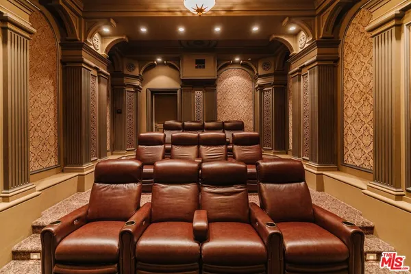 a media room with lots of chairs and a projector