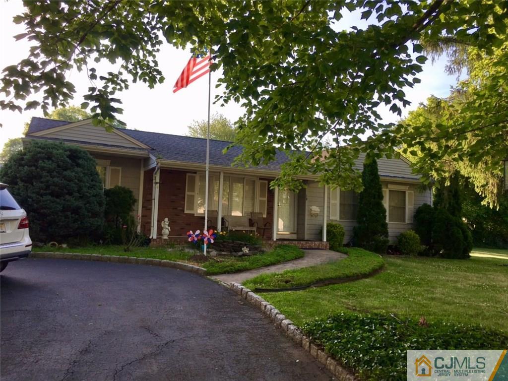 18 Harvard Road Old Bridge, NJ 08859 - Photo 1 of 24 a front view of a house with a yard and garage
