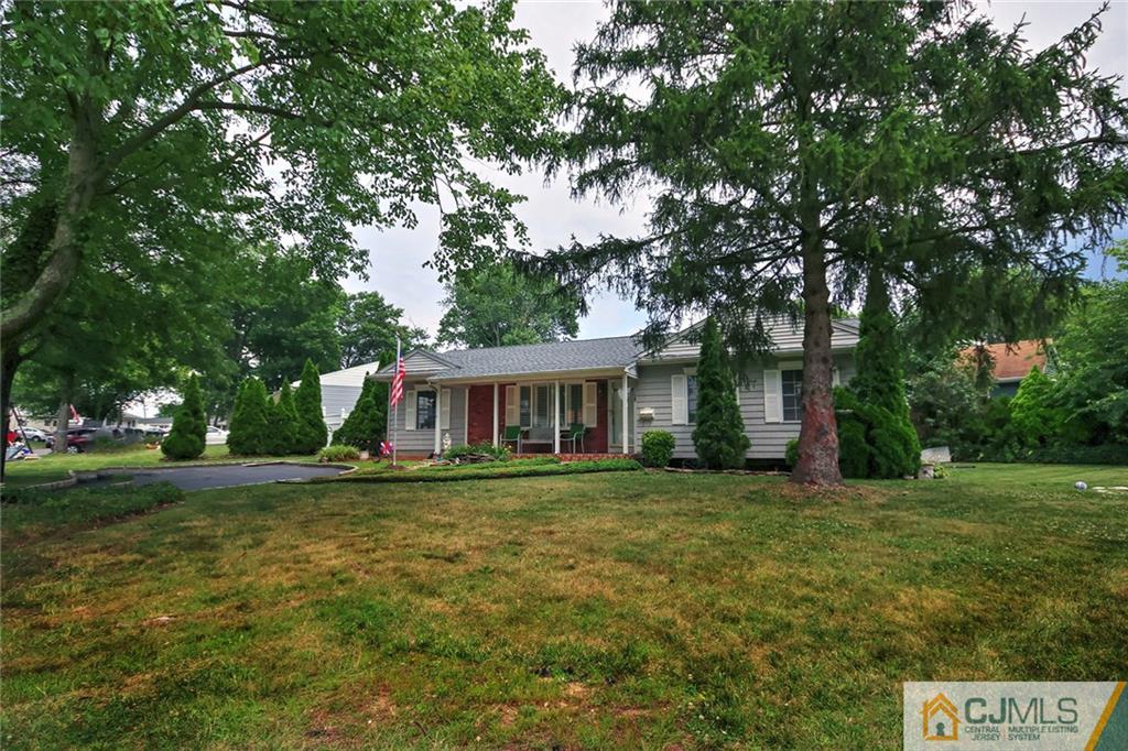 18 Harvard Road Old Bridge, NJ 08859 - Photo 2 of 24 a front view of a house with a garden