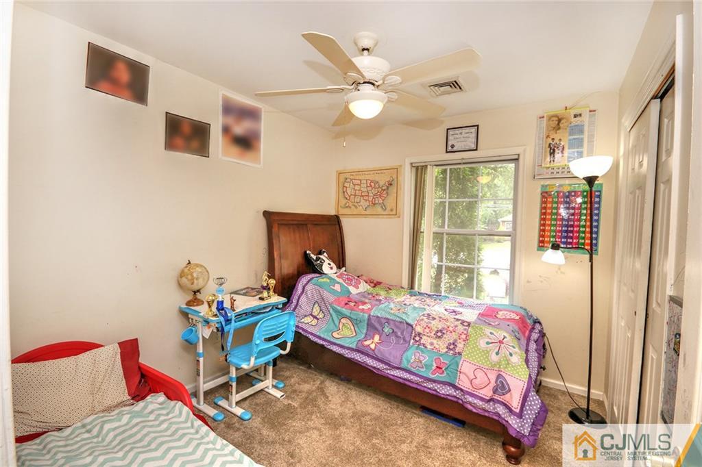 18 Harvard Road Old Bridge, NJ 08859 - Photo 14 of 24 a bedroom with a bed and a window