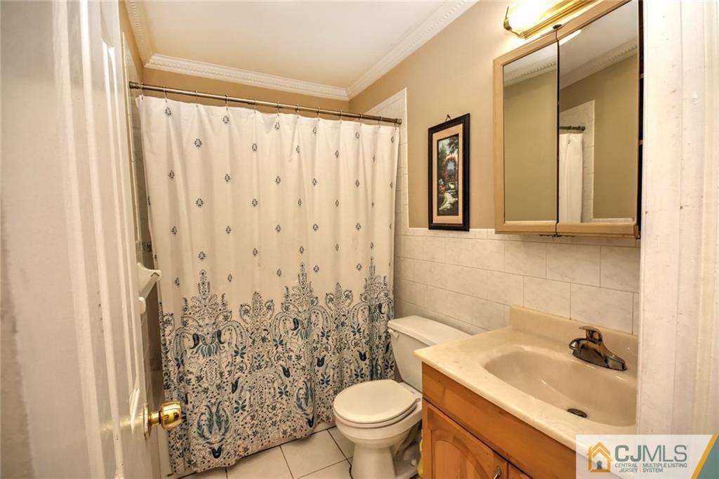 18 Harvard Road Old Bridge, NJ 08859 - Photo 15 of 24 a bathroom with a sink toilet and shower
