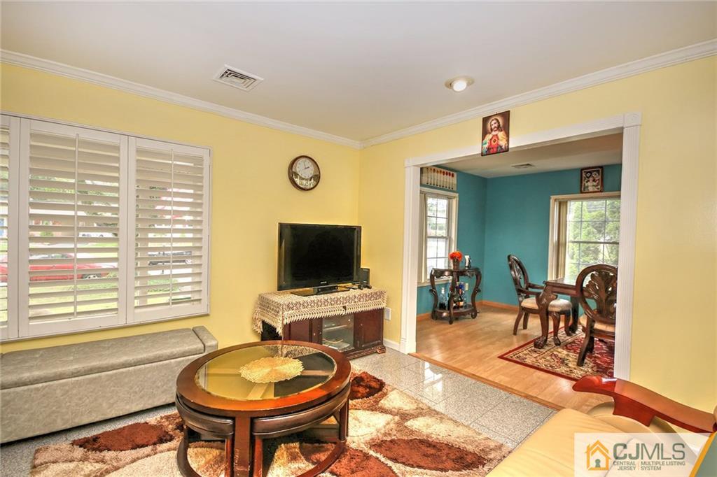 18 Harvard Road Old Bridge, NJ 08859 - Photo 16 of 24 a view of a livingroom with furniture and a flat screen tv