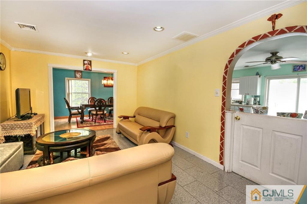 18 Harvard Road Old Bridge, NJ 08859 - Photo 18 of 24 a living room with furniture and a mirror
