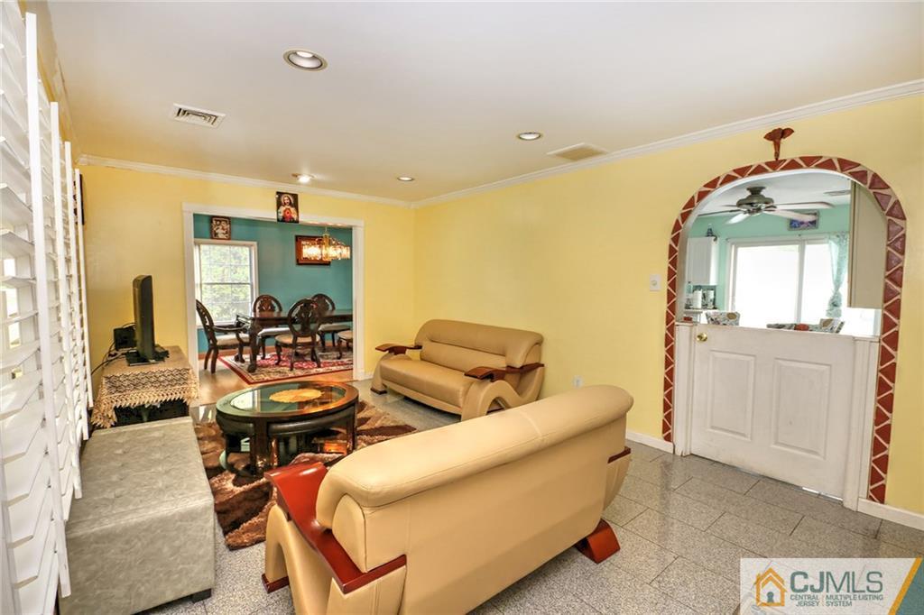 18 Harvard Road Old Bridge, NJ 08859 - Photo 19 of 24 a living room with furniture and a mirror