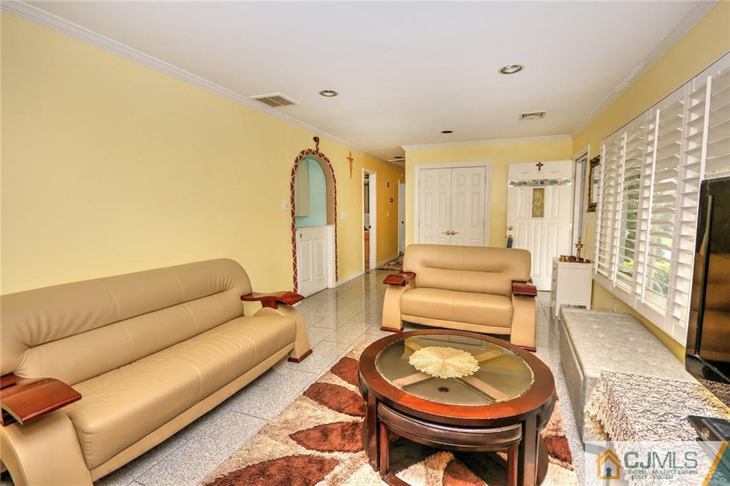 18 Harvard Road Old Bridge, NJ 08859 - Photo 20 of 24 a living room with a couch and a table
