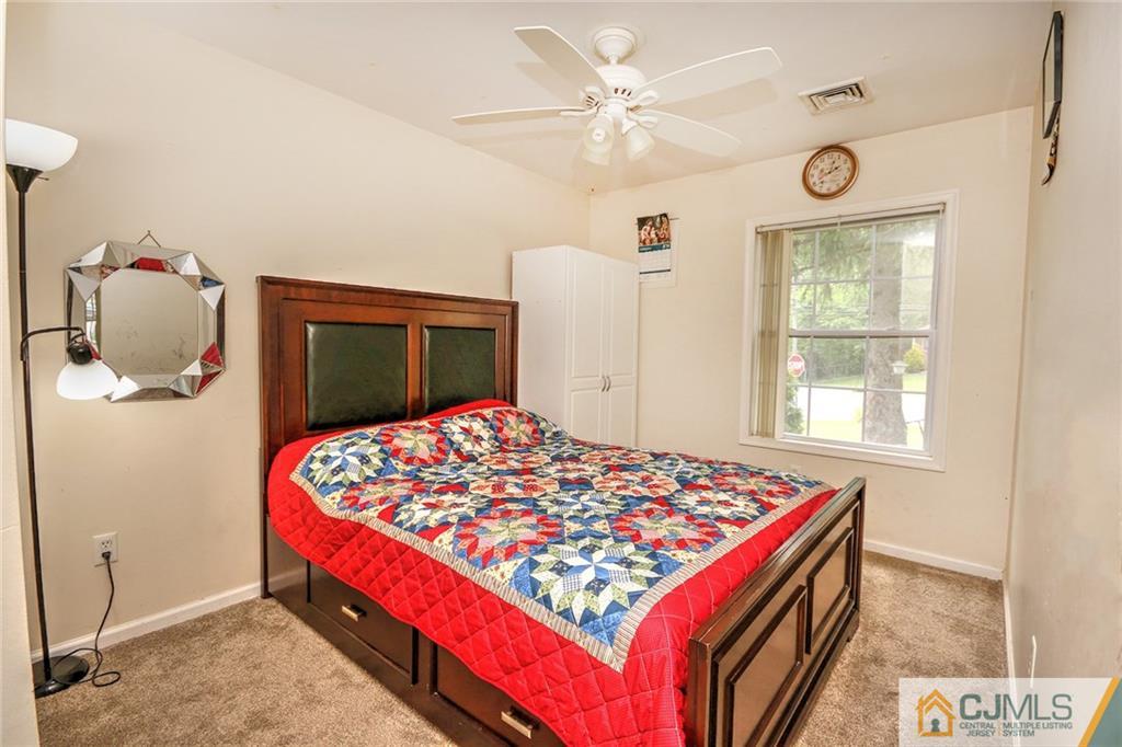 18 Harvard Road Old Bridge, NJ 08859 - Photo 9 of 24 a bedroom with a bed and a dresser