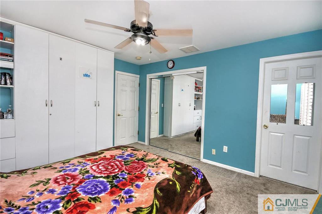 18 Harvard Road Old Bridge, NJ 08859 - Photo 10 of 24 a bedroom with a bed and a chandelier