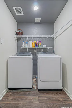 a utility room with two washing machine