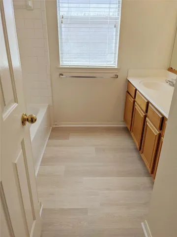 a view of a room with wooden floor and staircase
