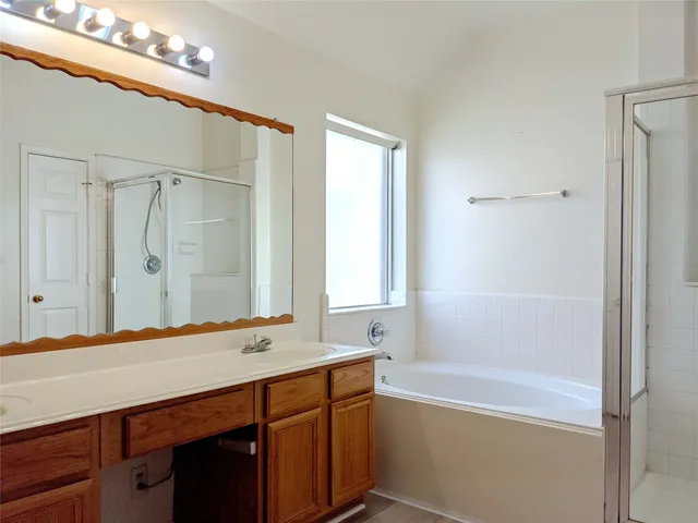 a bathroom with a bathtub and a sink