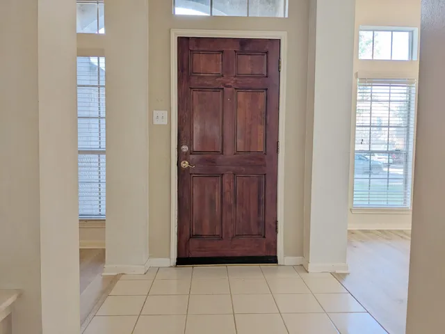 a view of a hallway with front door