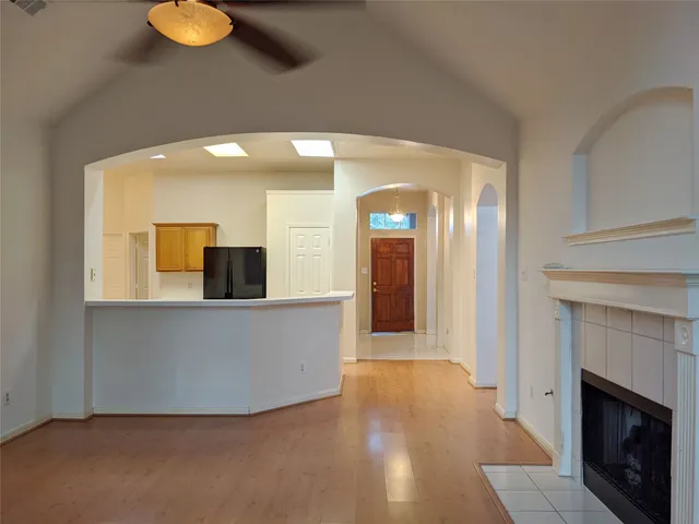 a view of a living room with furniture and fireplace