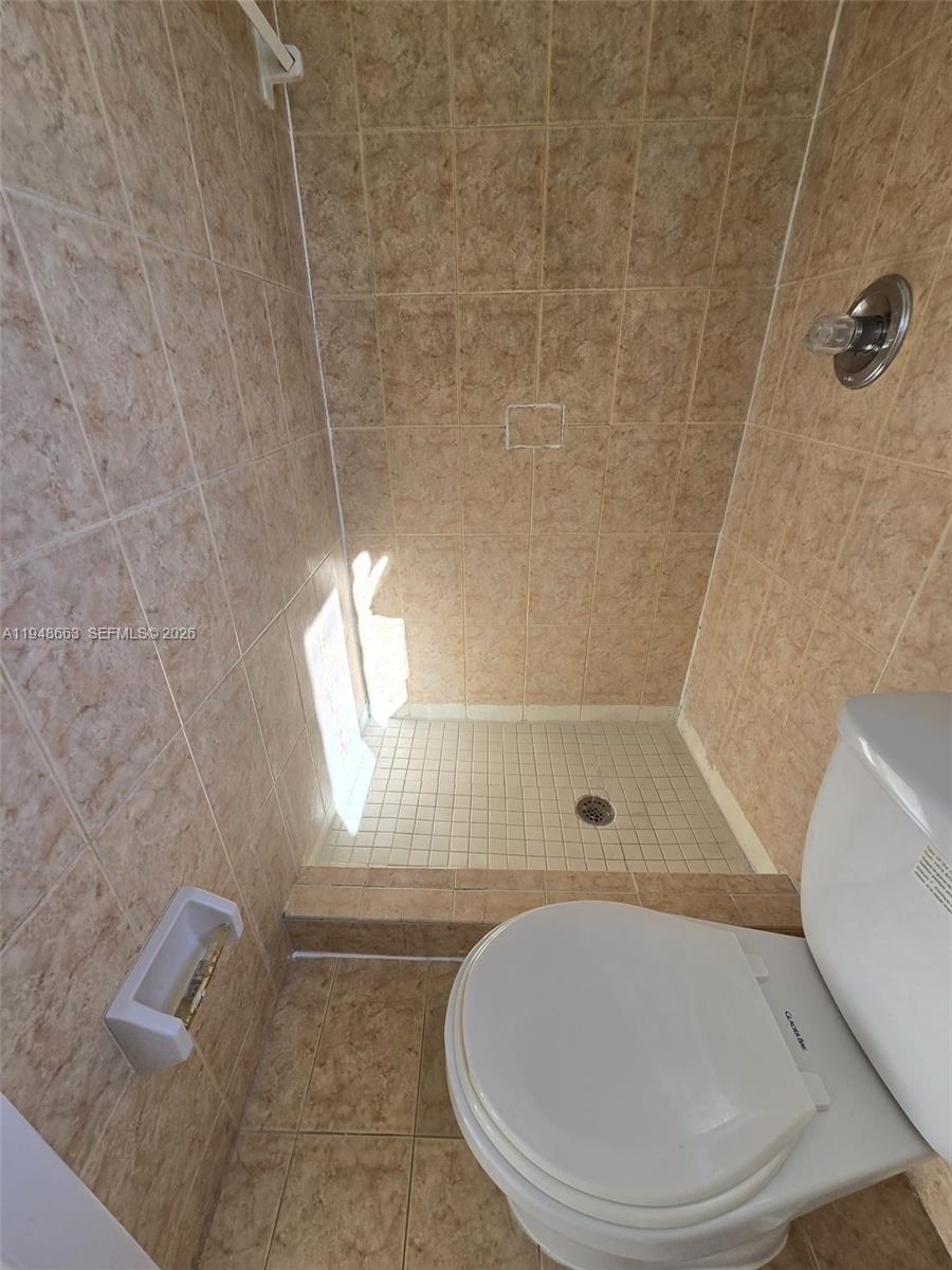 15764 Southwest 303rd Terrace Homestead, FL 33033 - Photo 12 of 14 a bathroom with a shower