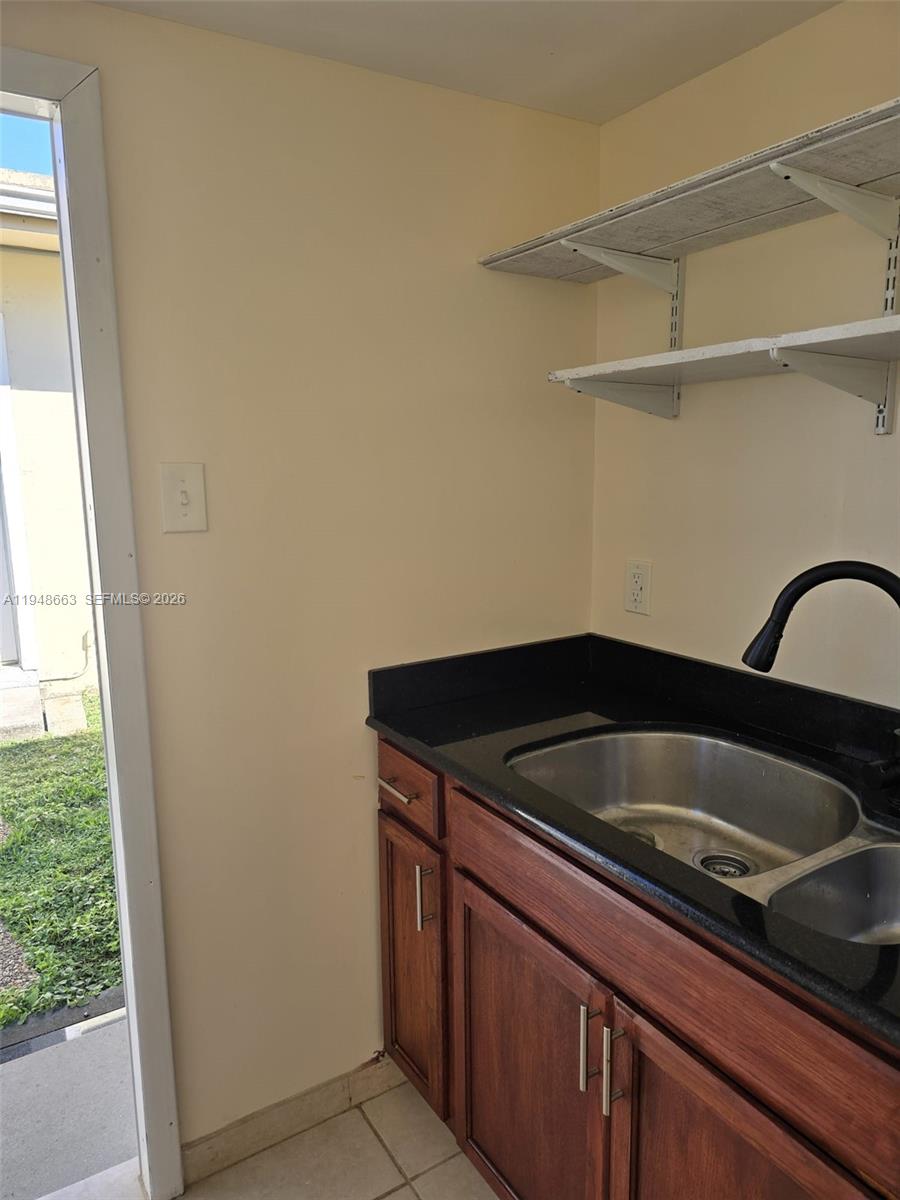 15764 Southwest 303rd Terrace Homestead, FL 33033 - Photo 6 of 14 a close view of sink and tap