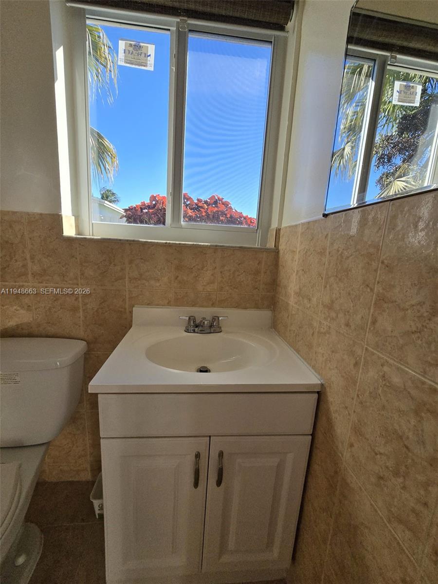 15764 Southwest 303rd Terrace Homestead, FL 33033 - Photo 10 of 14 a bathroom with a sink and a mirror