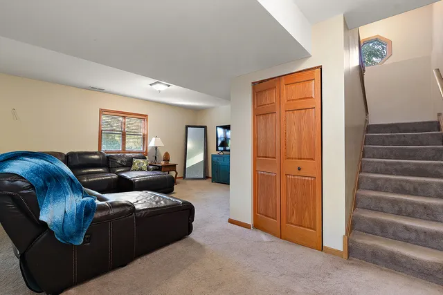 a living room with furniture and a gate